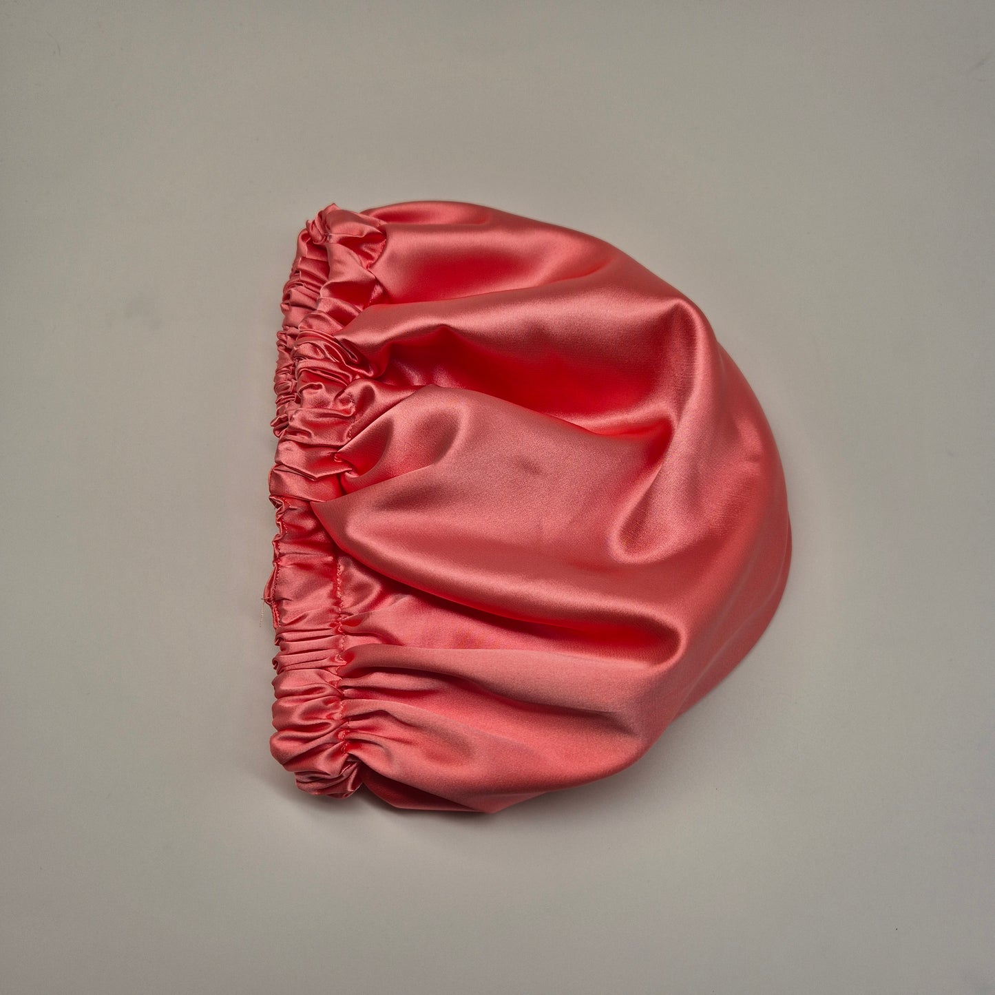 Schlafhaube aus Satin- Koralle