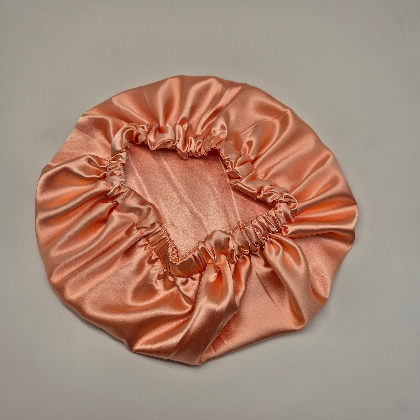 Schlafhaube aus Satin- Koralle
